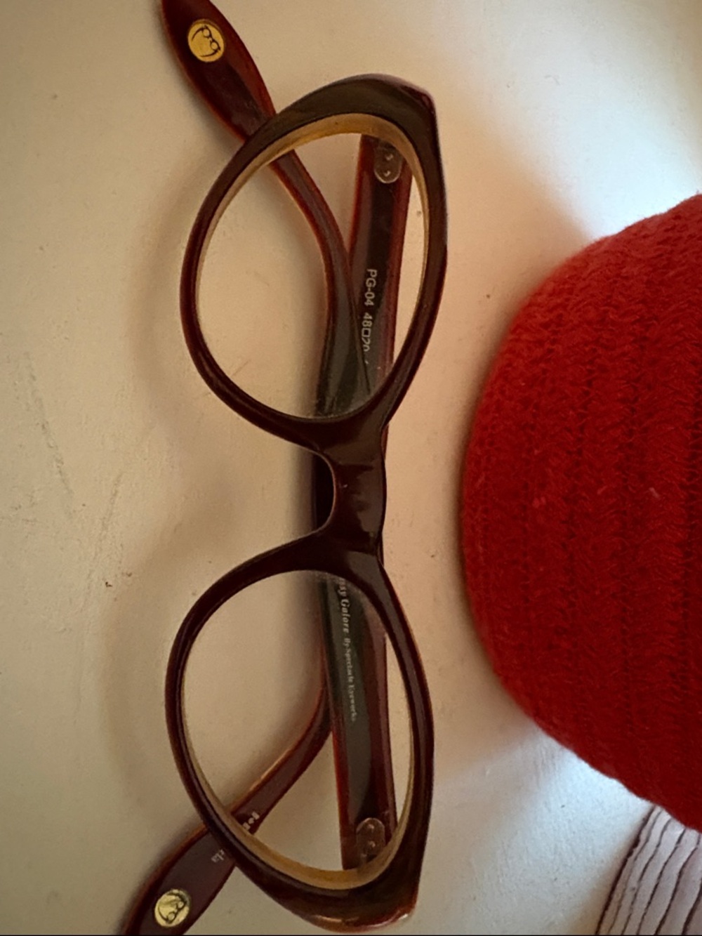 P*ssy Galore Cateye glasses in transparent maroon